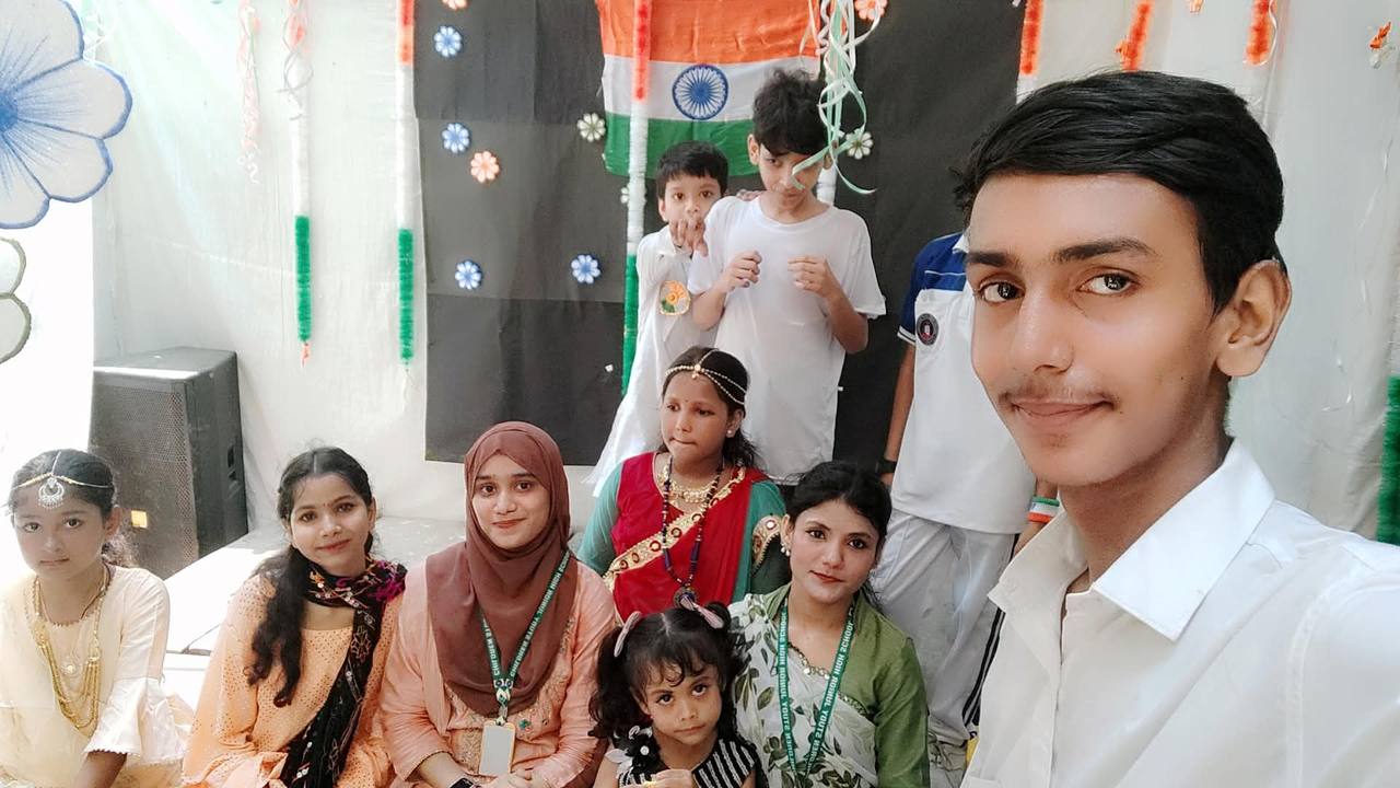 A selfie with staff and students at the school