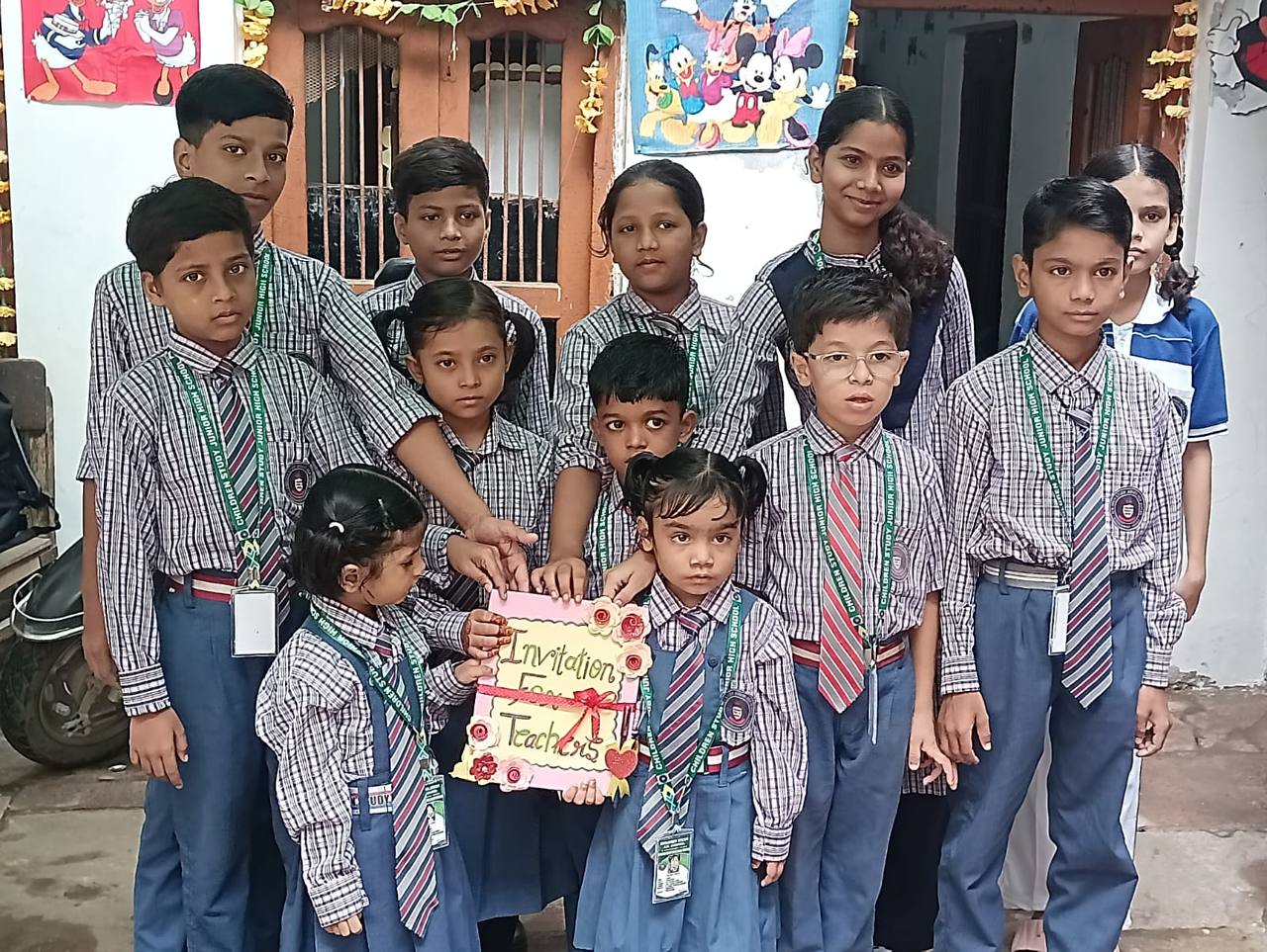 Students holding a Teachers' Day invitation card